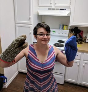 The author wearing two potholders.
