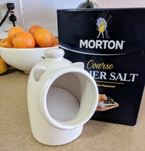 A ceramic container of salt shaped like a pig