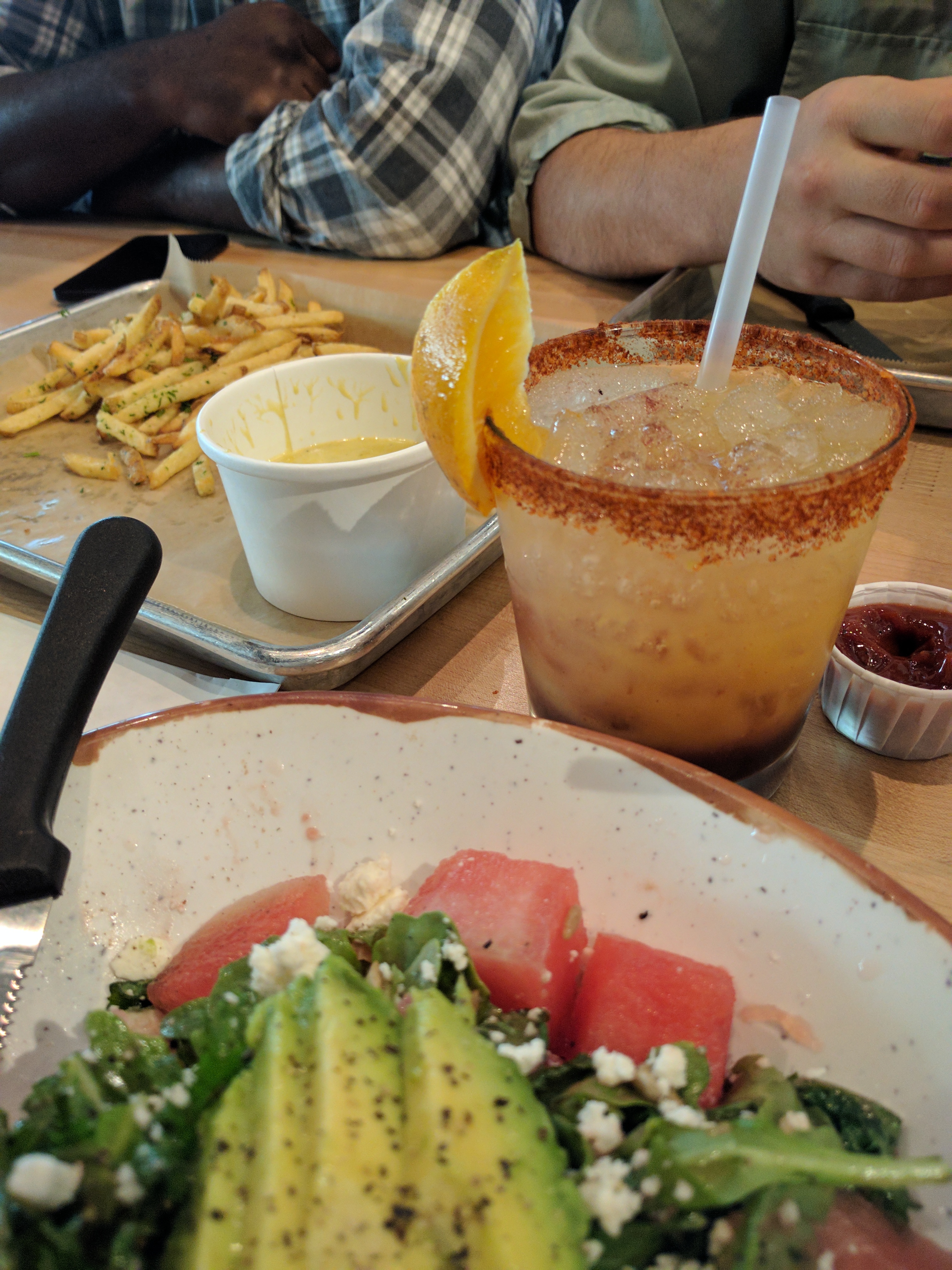A drink, salad, and fries
