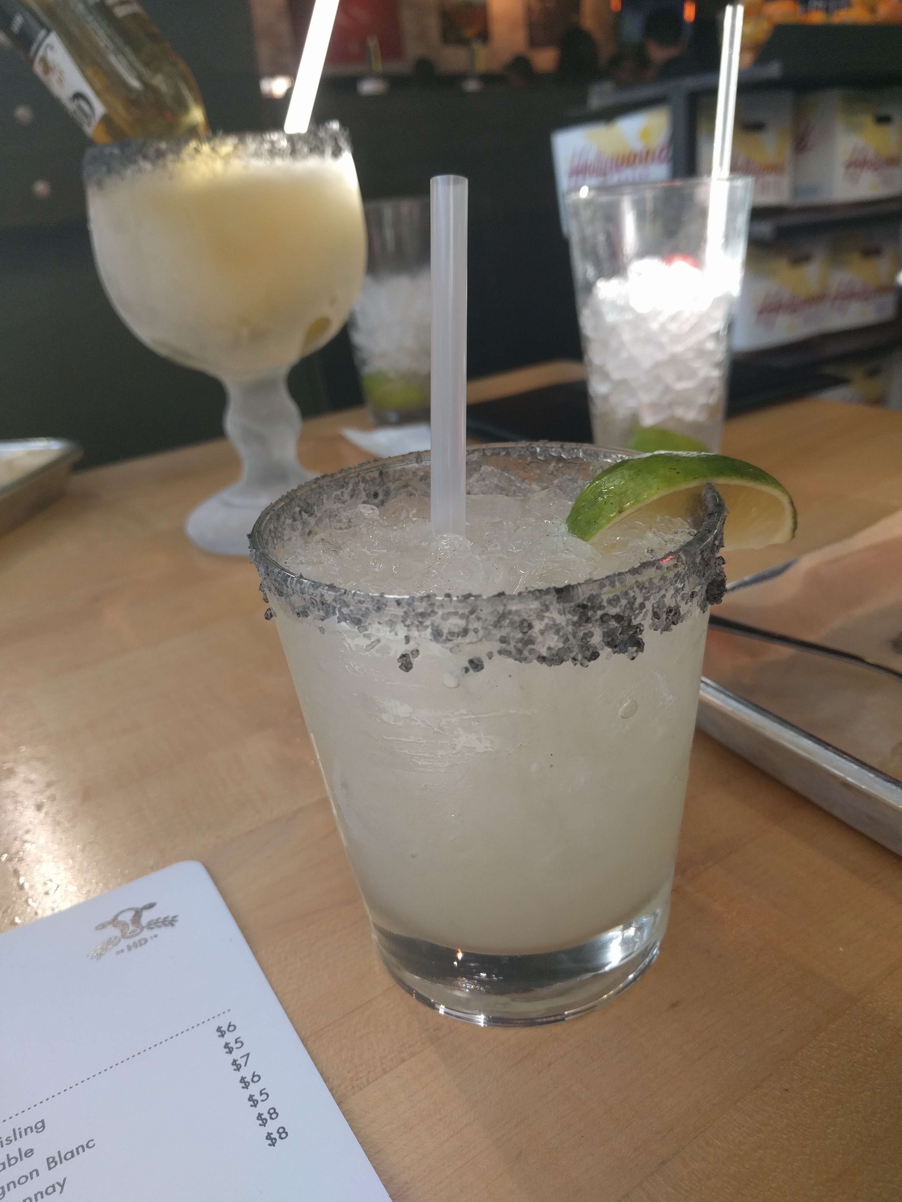 Frozen margarita with a black salt rim