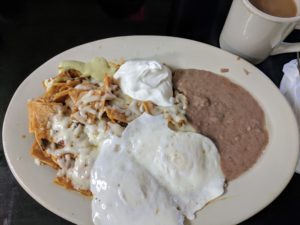 Chilaquiles coated in cheese